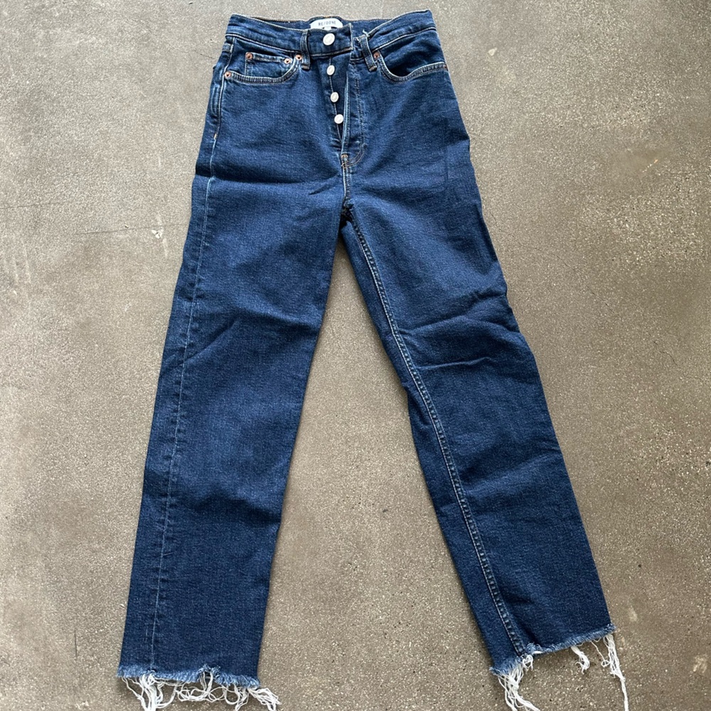 High-waisted RE/DONE blue jeans with raw hem